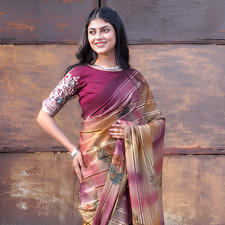 Aiswariya Sinha in a traditional saree, standing confidently against a rustic wall — symbolizing strength, heritage, and the courage to dream.